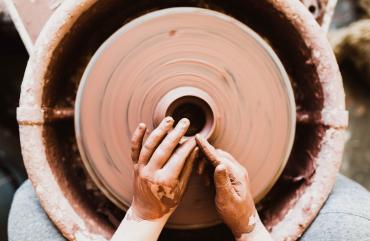 making a clay bowl by hand