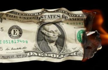 A dollar bill burning