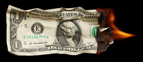 A dollar bill burning