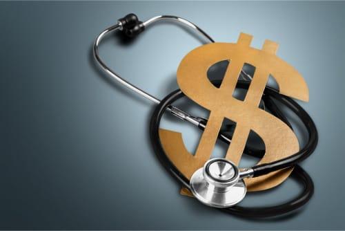 A dollar sign wrapped in a stethoscope
